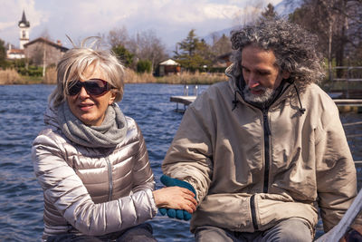 Portrait of smiling woman sitting in water