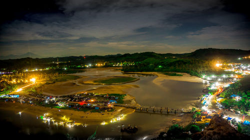 High angle view of illuminated cityscape at night