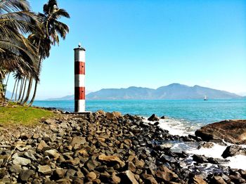 Scenic view of sea against clear blue sky