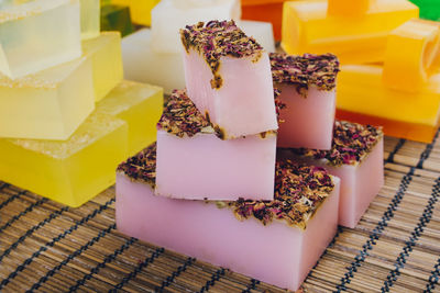 Close-up of multi colored soap bars for sale on table