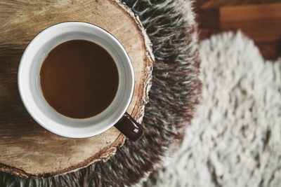 High angle view of coffee cup on table