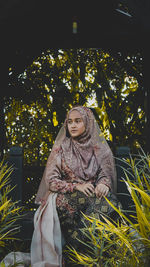 A woman wearing traditional clothing wedding for malaysian