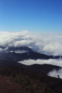 Scenic view of clouds over mountain