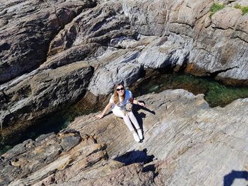 Full length of woman on rock