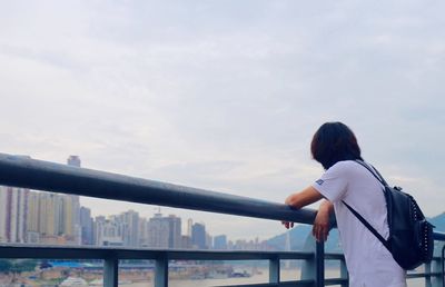 Silhouette of woman standing against sky