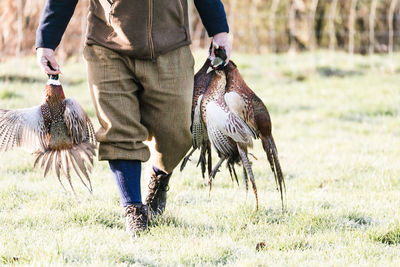 Full length of man standing on field