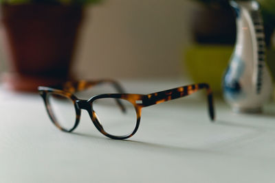 Close-up of eyeglasses on table