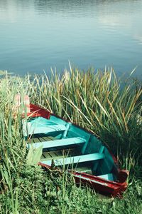 Boats moored on field