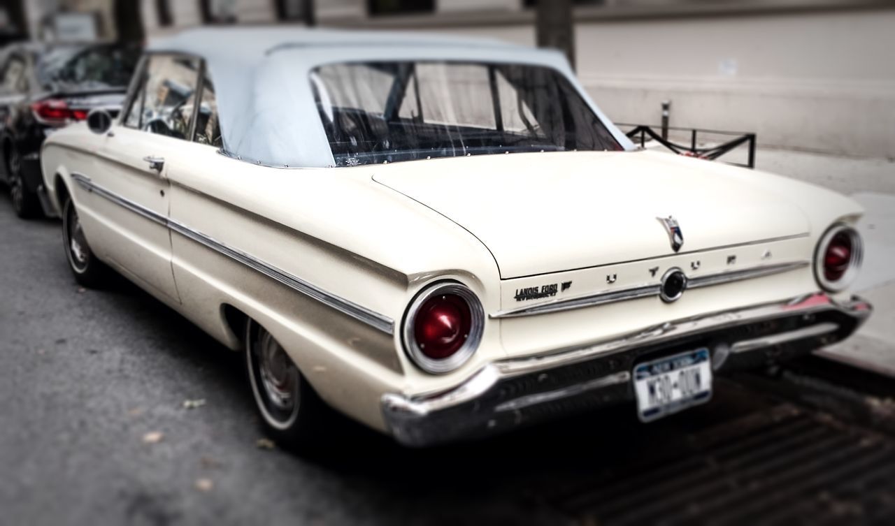 transportation, mode of transport, land vehicle, car, stationary, focus on foreground, close-up, retro styled, selective focus, old-fashioned, still life, no people, day, vintage car, street, white color, outdoors, metal, single object, parked