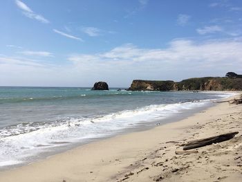 Scenic view of beach against sky