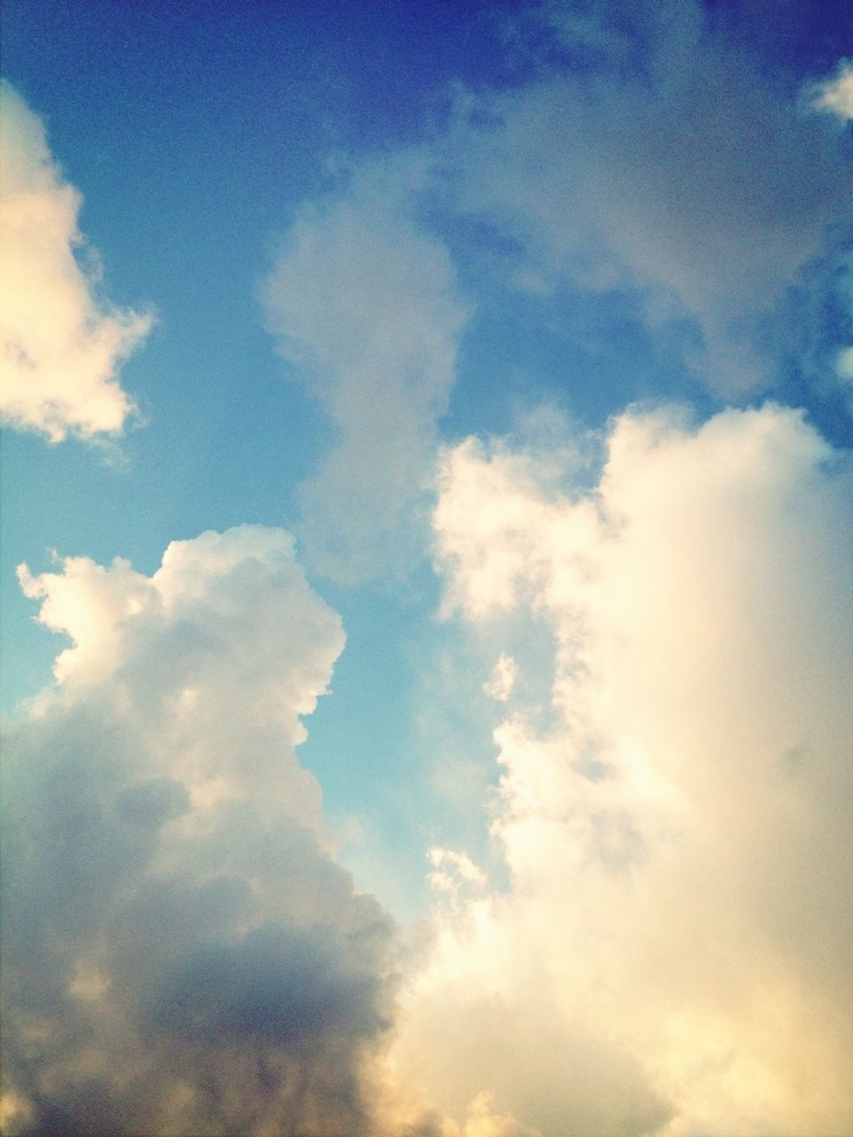 sky, cloud - sky, low angle view, beauty in nature, tranquility, scenics, blue, sky only, tranquil scene, nature, cloudy, cloud, cloudscape, backgrounds, idyllic, full frame, outdoors, no people, day, majestic