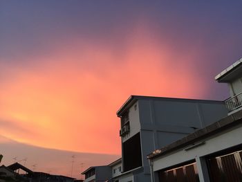 Low angle view of building against sky during sunset