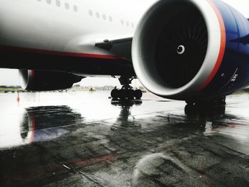 Airplane seen through wet glass