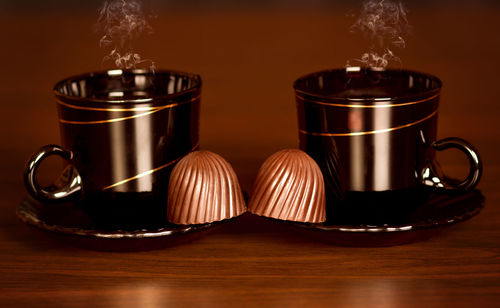 Close-up of illuminated candles on table