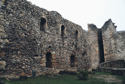 Low angle view of old building against sky