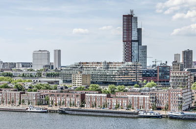 Modern buildings in city against sky