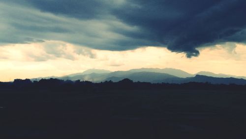 Scenic view of silhouette landscape against sky during sunset