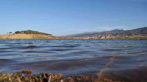 Scenic view of sea against clear blue sky