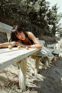 Young woman sitting on bench