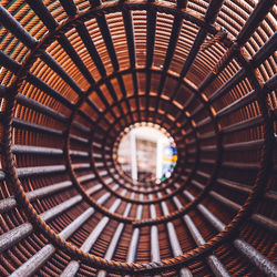 Directly below shot of spiral staircase in building