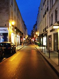 Illuminated city street at night