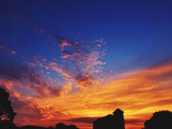 Low angle view of cloudy sky at sunset