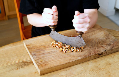 Midsection of woman holding christmas tree