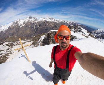 Person standing on snow covered mountain