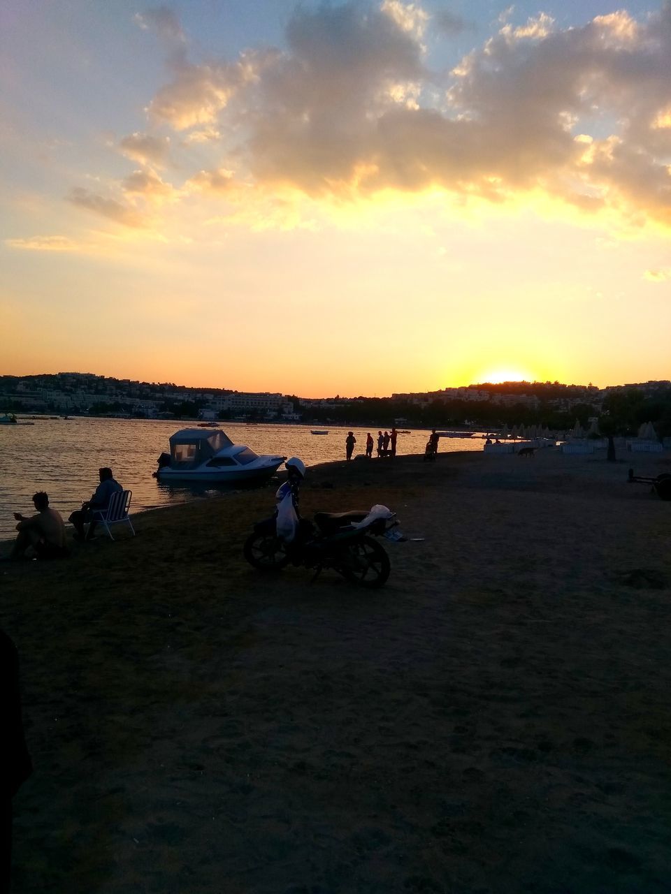 VIEW OF BEACH AGAINST SKY DURING SUNSET