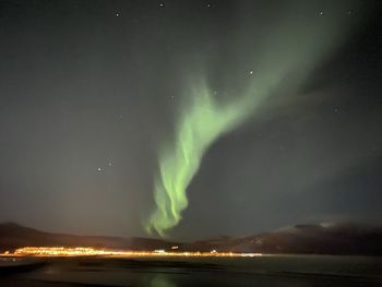 Scenic view of illuminated mountain against sky at night