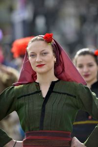 Portrait of smiling young woman standing outdoors