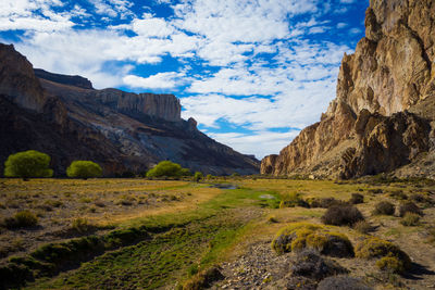 Scenic view of landscape and mountains against sky