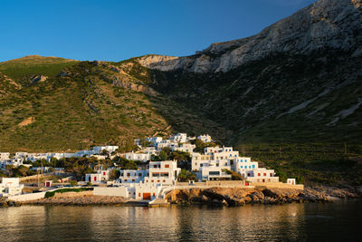 Kamares town with traditional white houses on sifnos island on sunset. greece