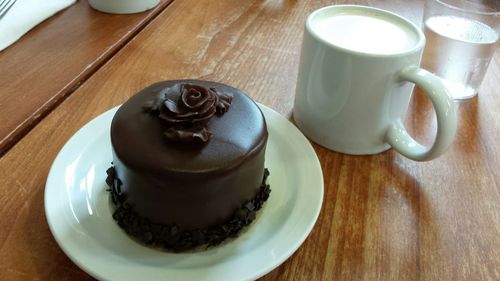 High angle view of coffee on wooden table