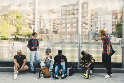 Group of people in front of modern buildings