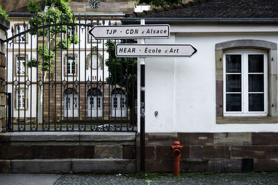 Information sign against building