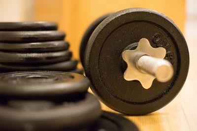 Close-up of barbell on hardwood floor