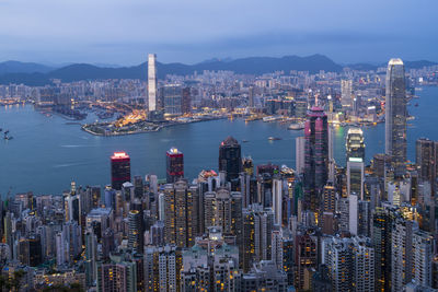 Aerial view of city buildings at waterfront