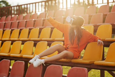 A young athlete wearing virtual reality glasses, dressed in sportswear