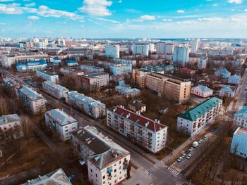 High angle view of city buildings against sky