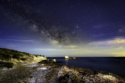 Scenic view of sea against sky at night