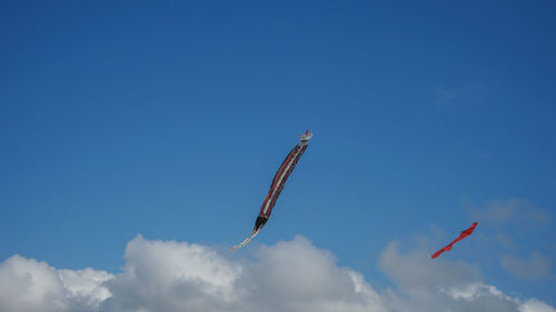 Low angle view of airplane flying in sky