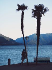 Scenic view of sea with mountain in background