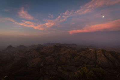 Scenic view of rocky mountains against sky during sunset