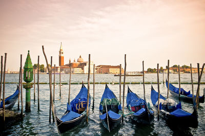 Boats moored at harbor