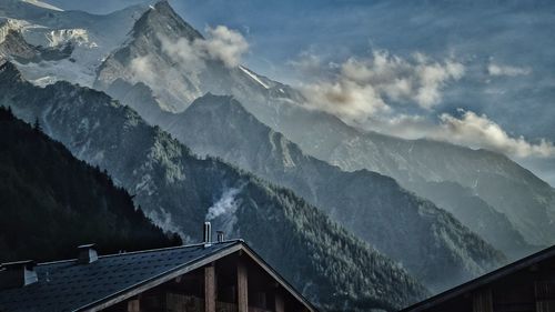 Scenic view of snowcapped mountains against sky