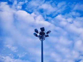 Low angle view of street light against cloudy sky