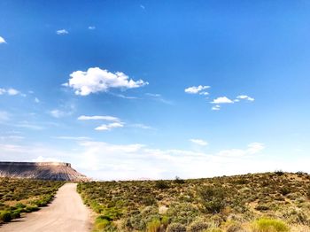 Scenic view of landscape against blue sky