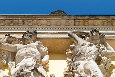 Low angle view of statue against sky