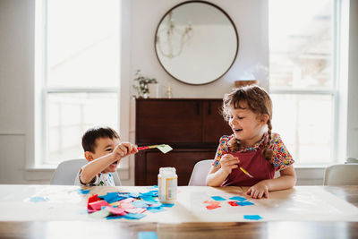 Brother and sister having art and crafts time together